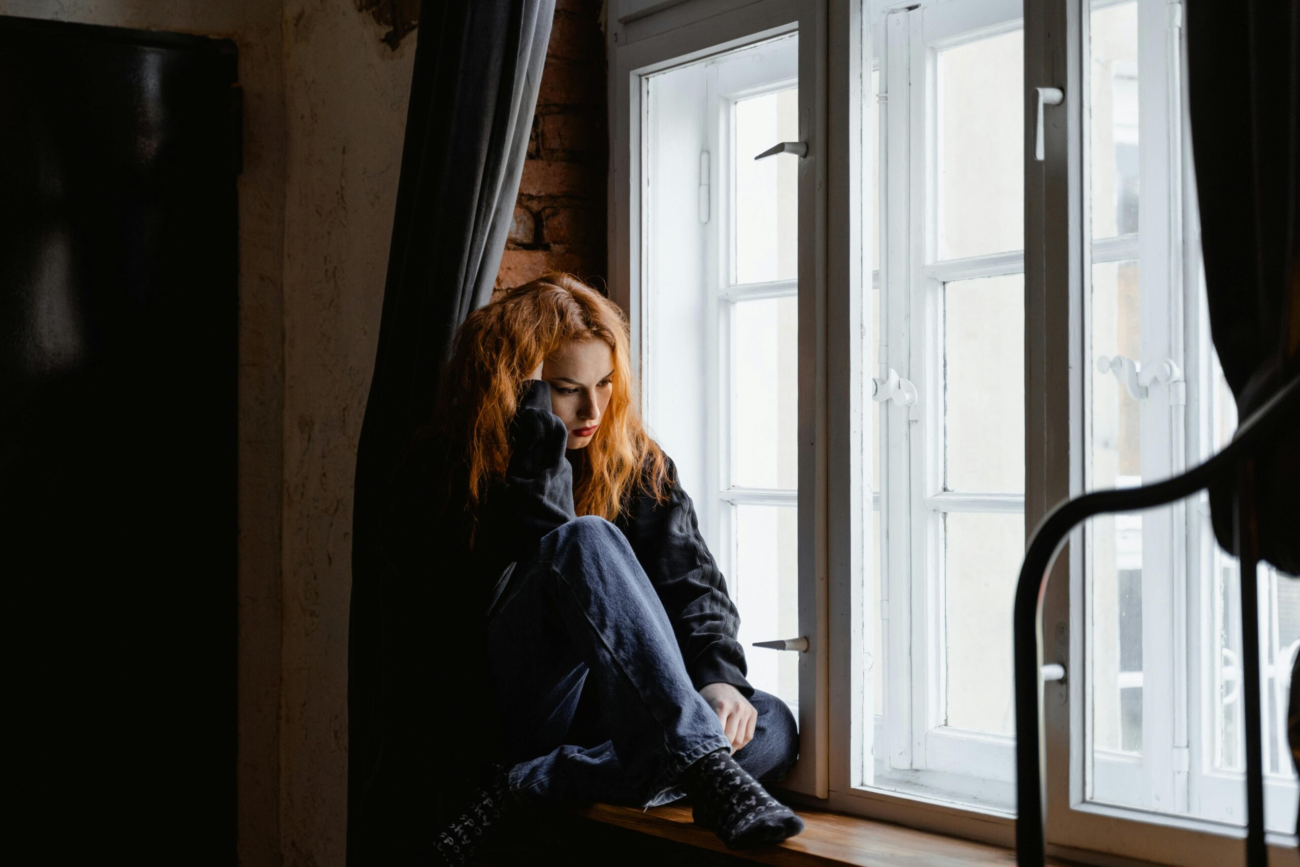 Woman sitting who is worried about Estrogen Histamine and Thyroid